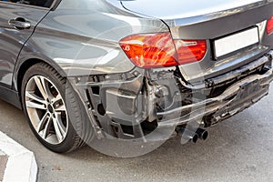 Tail of modern car with removed rear bumper. Vehicle after traffic accident and crash. Transport repair and insurance photo