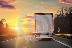 Tail view white blank modern delivery big shipment cargo commercial semi trailer truck moving motorway road city urban