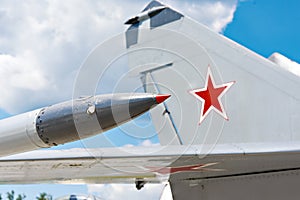 Tail and wing of soviet military jet fighter