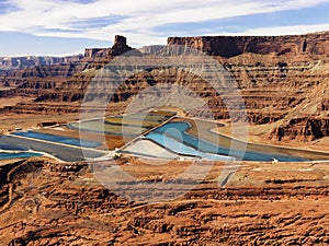 Tailing Ponds in Craggy Landscape photo