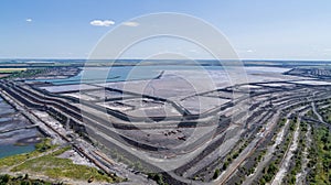 Tailings dump in industrial city aerial view