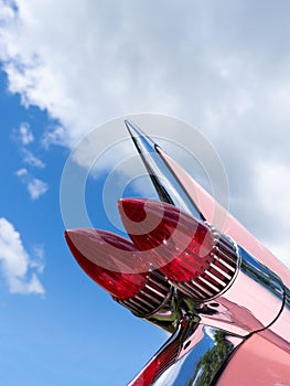 Taillight of an old classic American car, wide angle shot, sunny summer day