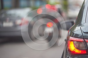 Taillight or rear lamp of car on blur traffic street view background