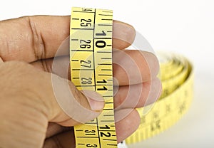 Tailor holding a measuring tape