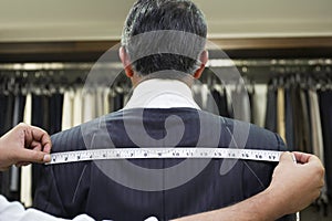Tailor Fitting Man in Suit