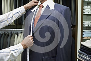 Tailor Fitting Man in Suit