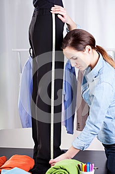 Tailor measuring pant suit