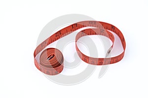 Tailor measuring tape isolated on white background, Red measuring tape shallow depth of field