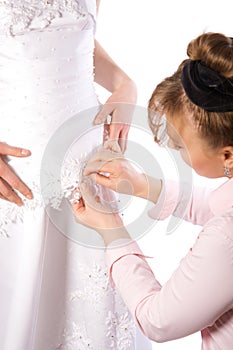 Tailor sew dress of bride