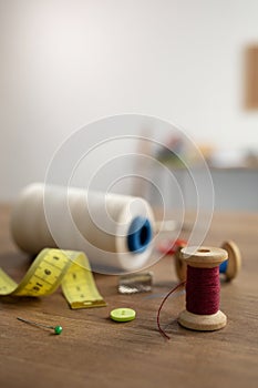 Tailor or sewing accessories with supplies and tools at table. Concept of clothes atelier