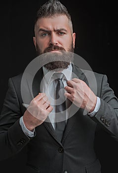 Tailor shop. Man suit fashion. Meeting suit. Businessman in dark grey suit. Business confident. Man in classic suit