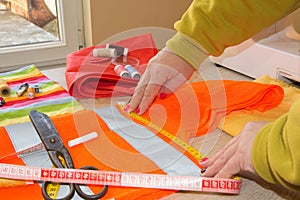 Tailor Woman, fashion designer working at studio. Fashion Designer Cutting Fabric In Studio