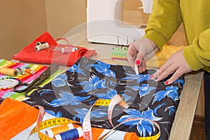 Tailor Woman, fashion designer working at studio. Fashion Designer Cutting Fabric In Studio