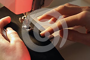 Tailor at Work on Sewing Machine