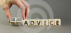 Tailored or trusted advice symbol. Concept words Tailored advice and Trusted advice on wooden cubes. Businessman hand. Beautiful