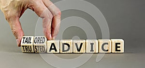 Tailored or trusted advice symbol. Concept words Tailored advice and Trusted advice on wooden cubes. Businessman hand. Beautiful photo