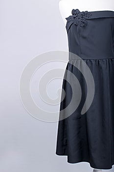 Tailors Mannequin dressed in a Black Dress with Flower