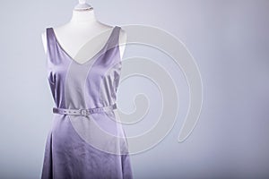 Tailors Mannequin dressed in a Lilac Satin Dress