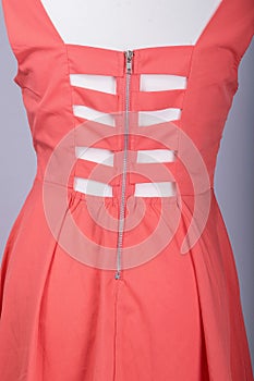 Tailors Mannequin dressed in a Pink Dress with Strappy Back photo