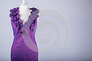 Tailors Mannequin dressed in a Purple Ruffle Dress