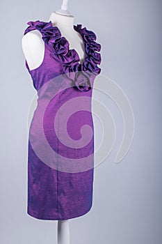 Tailors Mannequin dressed in a Purple Ruffle Dress