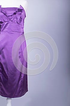 Tailors Mannequin dressed in a Purple Satin Dress