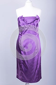 Tailors Mannequin dressed in a Purple Satin Dress