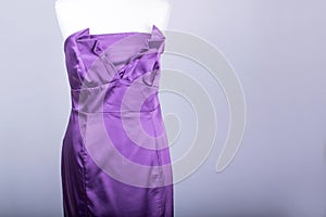 Tailors Mannequin dressed in a Purple Satin Dress