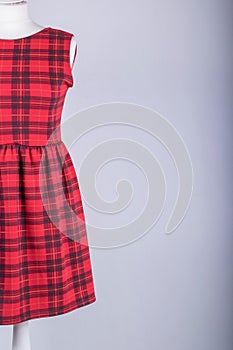 Tailors Mannequin dressed in a Red Tartan Dress