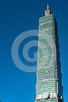 Taipei 101 skyscraper building close up view over dark blue sky