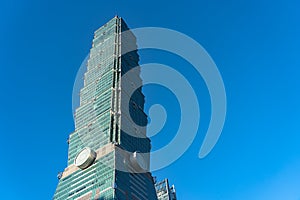 Taipei 101 skyscraper building close up view over dark blue sky