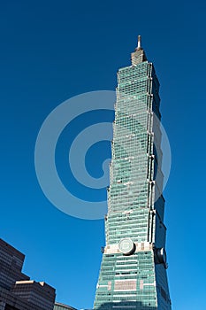 Taipei 101 skyscraper building close up view over dark blue sky