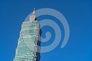 Taipei 101 skyscraper building close up view over dark blue sky