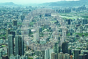 Taipei cityscape and blue sky visible from Taipei 101