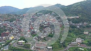 TAIWAN, JIUFEN - MAY, 2023: Aerial drone of old town Jiufen, famous landmark tourist village on the mountain in Taiwan.