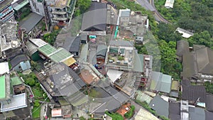 TAIWAN, JIUFEN - MAY, 2023: Aerial drone of old town Jiufen, famous landmark tourist village on the mountain in Taiwan.