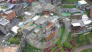 TAIWAN, JIUFEN - MAY, 2023: Aerial drone of old town Jiufen, famous landmark tourist village on the mountain in Taiwan.