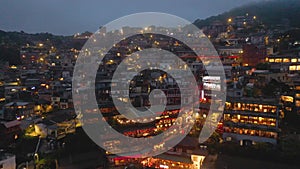 TAIWAN, JIUFEN - MAY, 2023: Aerial drone of old town Jiufen, famous landmark tourist village on the mountain in Taiwan.