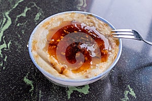 Taiwan`s distinctive famous snacks: Savory rice pudding Wa gui in a white bowl on stone table, Taiwan Delicacies