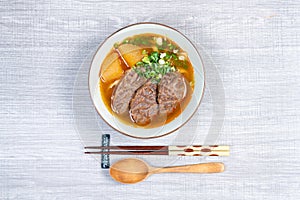 Taiwanese beef noodle soup is a noodle soup dish originating from Taiwan.  top view