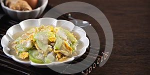 Taiwanese homemade local food of scrambled eggs with loofah gourd and sesame oil