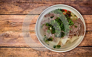 Taiwanese Sliced Beef Noodle Soup on rustic wood