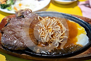 Taiwanese style beef steak and spaghetti photo