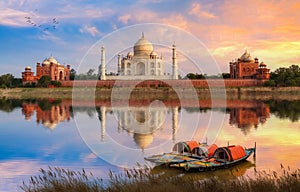 Taj Mahal Agra scenic sunset view with boats on the banks of river Yamuna at Agra India