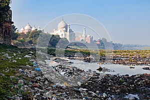 Taj Mahal beauty behind polluted Yamuna river trash garbage photo