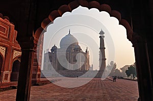 Taj Mahal in the fog at sunrise