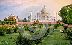 Taj Mahal historic monument at sunset as seen from Mehtab Bagh at Agra, India