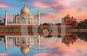 Taj Mahal historic white marble mausoleum on the banks of river Yamuna at sunset at Agra India