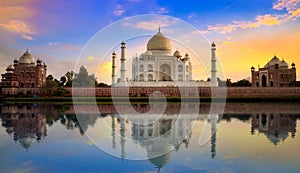 Taj Mahal historic white marble mausoleum on the banks of river Yamuna at sunset at Agra India