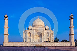 Taj Mahal in India under blue sky with the inscription of the coran in arabic letter meaning in english: This is an invitation to